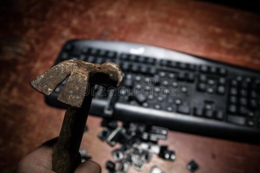 hammer-computer-keyboard-damaged-keys-broken-wooden-table-no-dark-desktop-174188515.jpeg