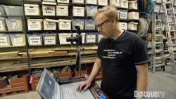 Adam-Savage-from-Mythbusters-with-his-Apple-Mac-laptop-checking-out-some-high-speed-footage-of-a.jpg