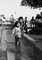 girl running through fountain at balboa park.jpg