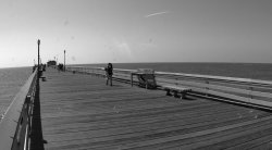 Woman making bubbles on a pier.jpg