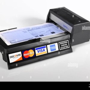 manual-credit-card-machine-old-technology-a-manually-operated-credit-card-imprinter-with-credi...jpg