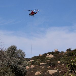 helicopter picking up phone pole x.jpg