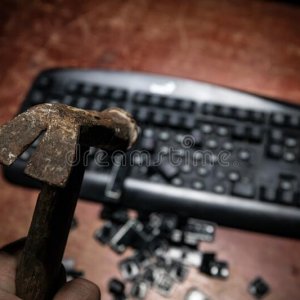 hammer-computer-keyboard-damaged-keys-broken-wooden-table-no-dark-desktop-174188515.jpeg