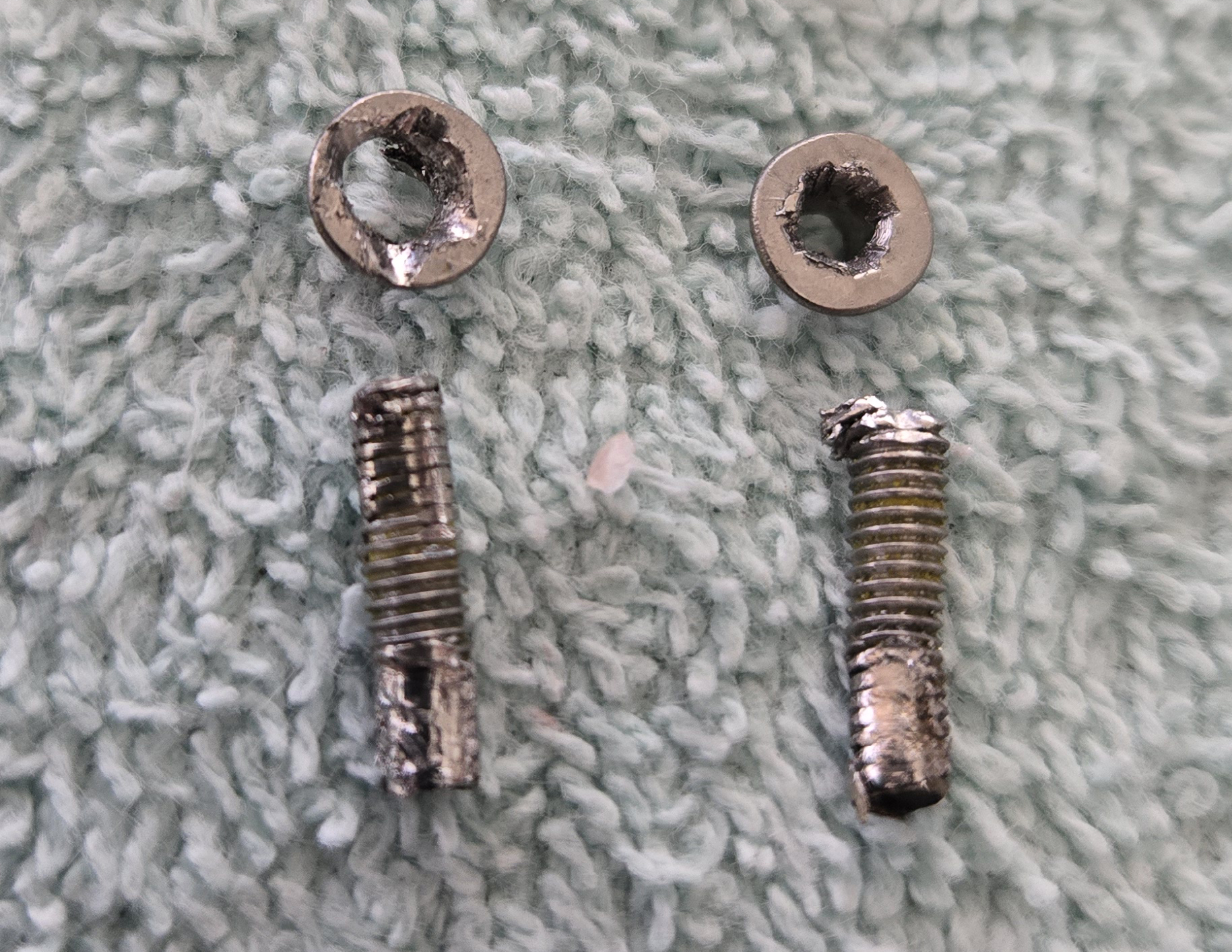 2025-04-01.1225, The Drilled Out Screws from CPU B Cooling Pad.jpg