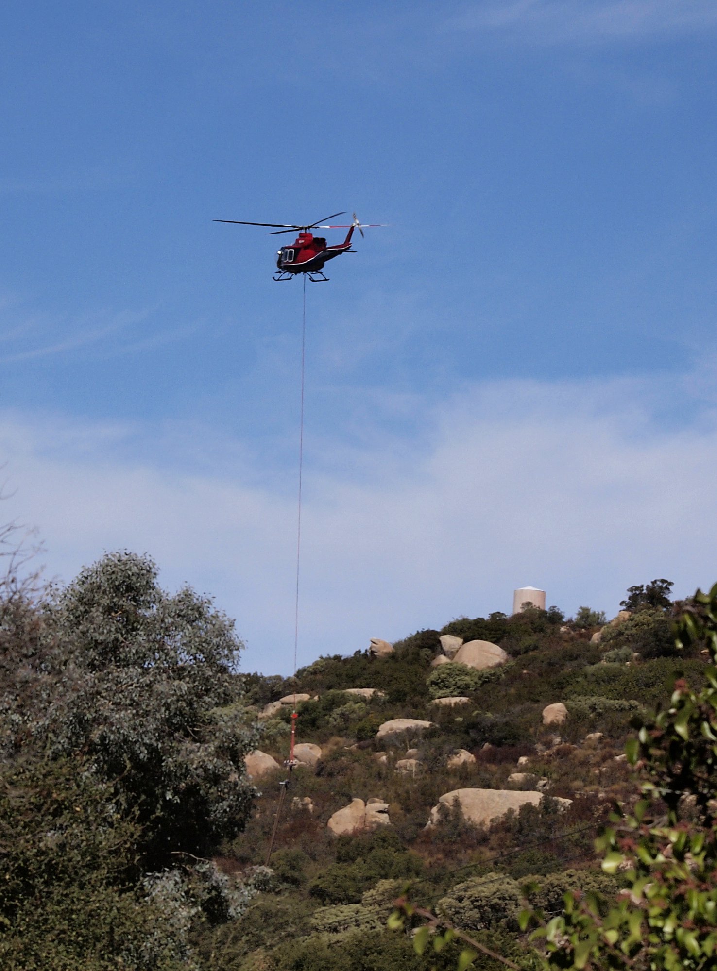 helicopter picking up phone pole x.jpg