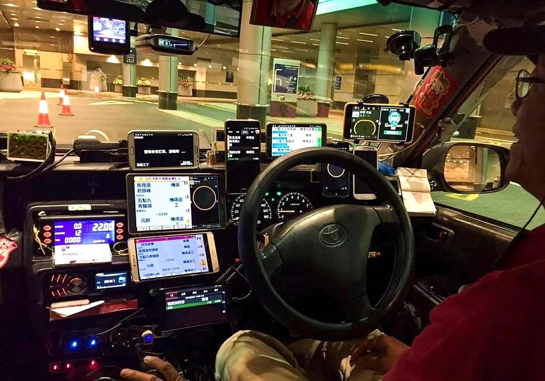 hong-kong-taxi-driver-has-over-10-mobile-phones-on-his-v0-m3ntffbyt0ra1.jpg.jpeg