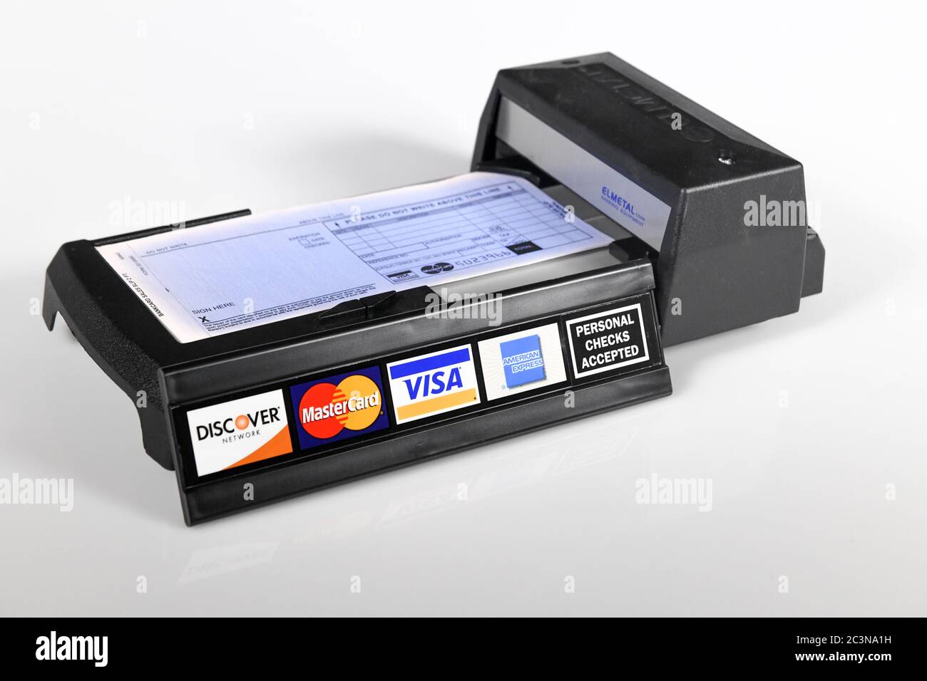 manual-credit-card-machine-old-technology-a-manually-operated-credit-card-imprinter-with-credi...jpg