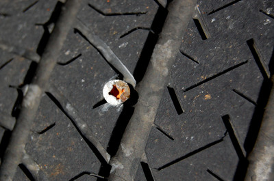 flat_tire_from_nail_or_screw.jpg