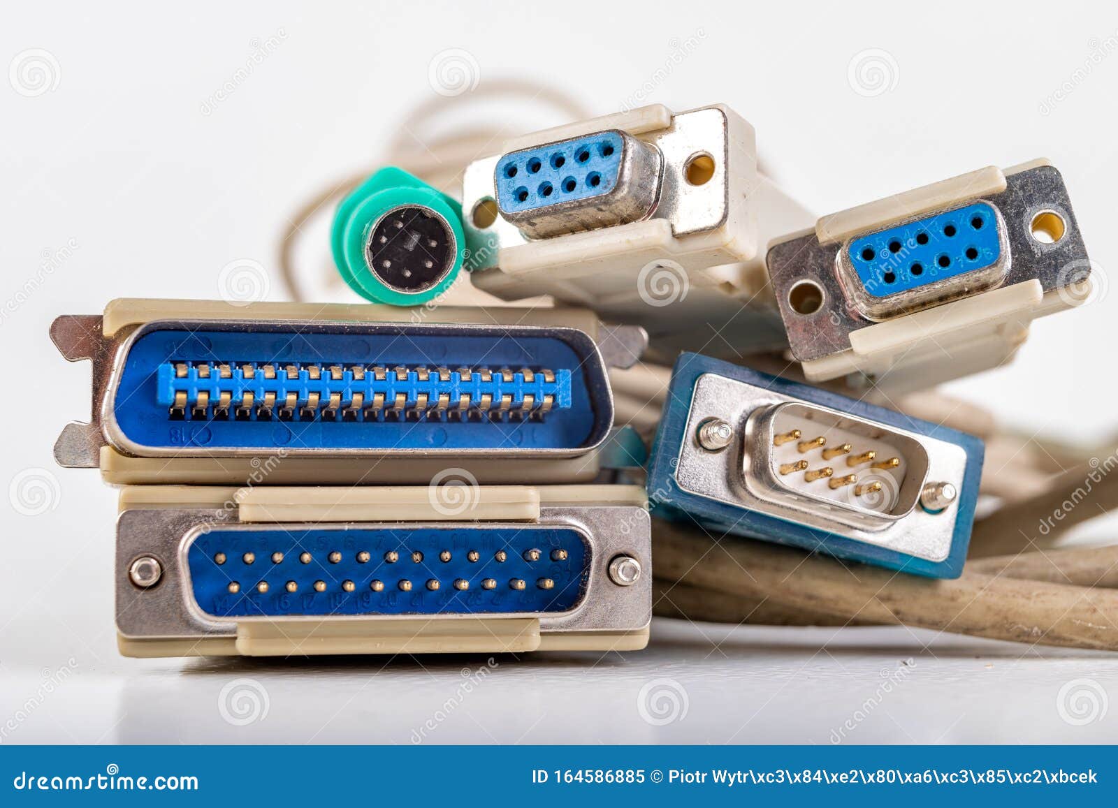 old-computer-cables-used-to-connect-peripheral-devices-plugs-connectors-old-applications-light-background-close-up-cord-164586885.jpg